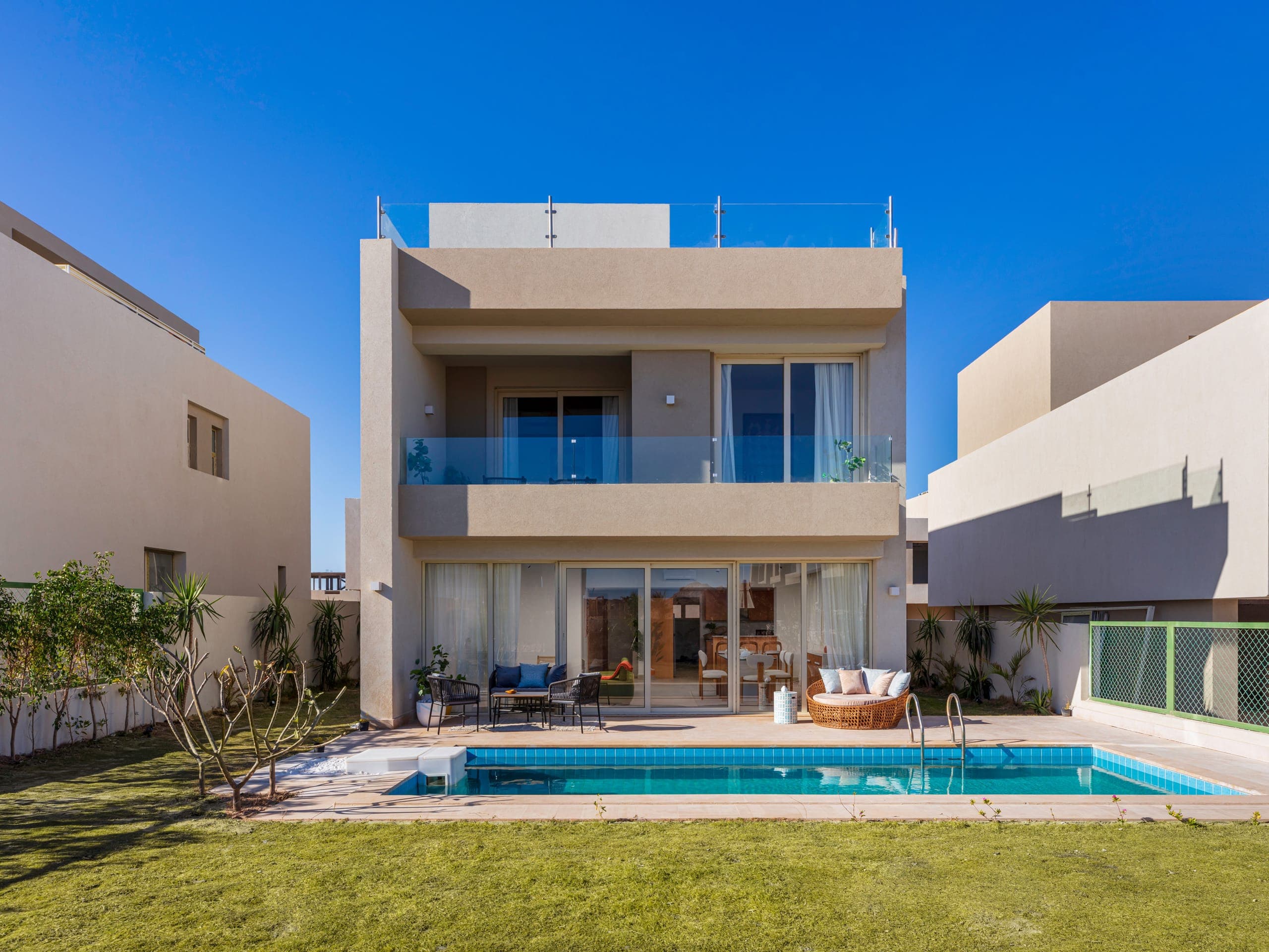 Modern TLD villa with private pool under a clear sky