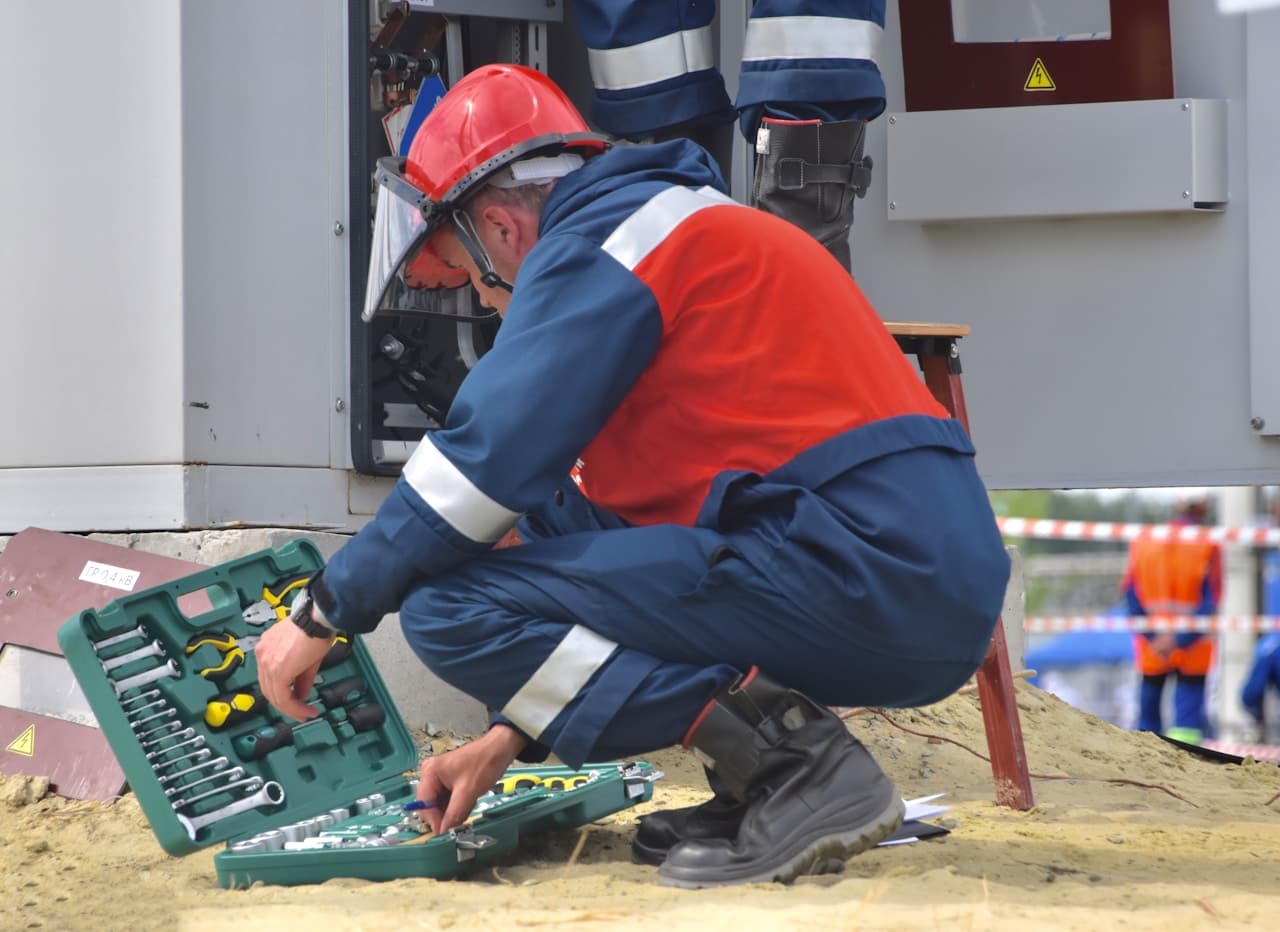Maintenance technician servicing an electrical panel