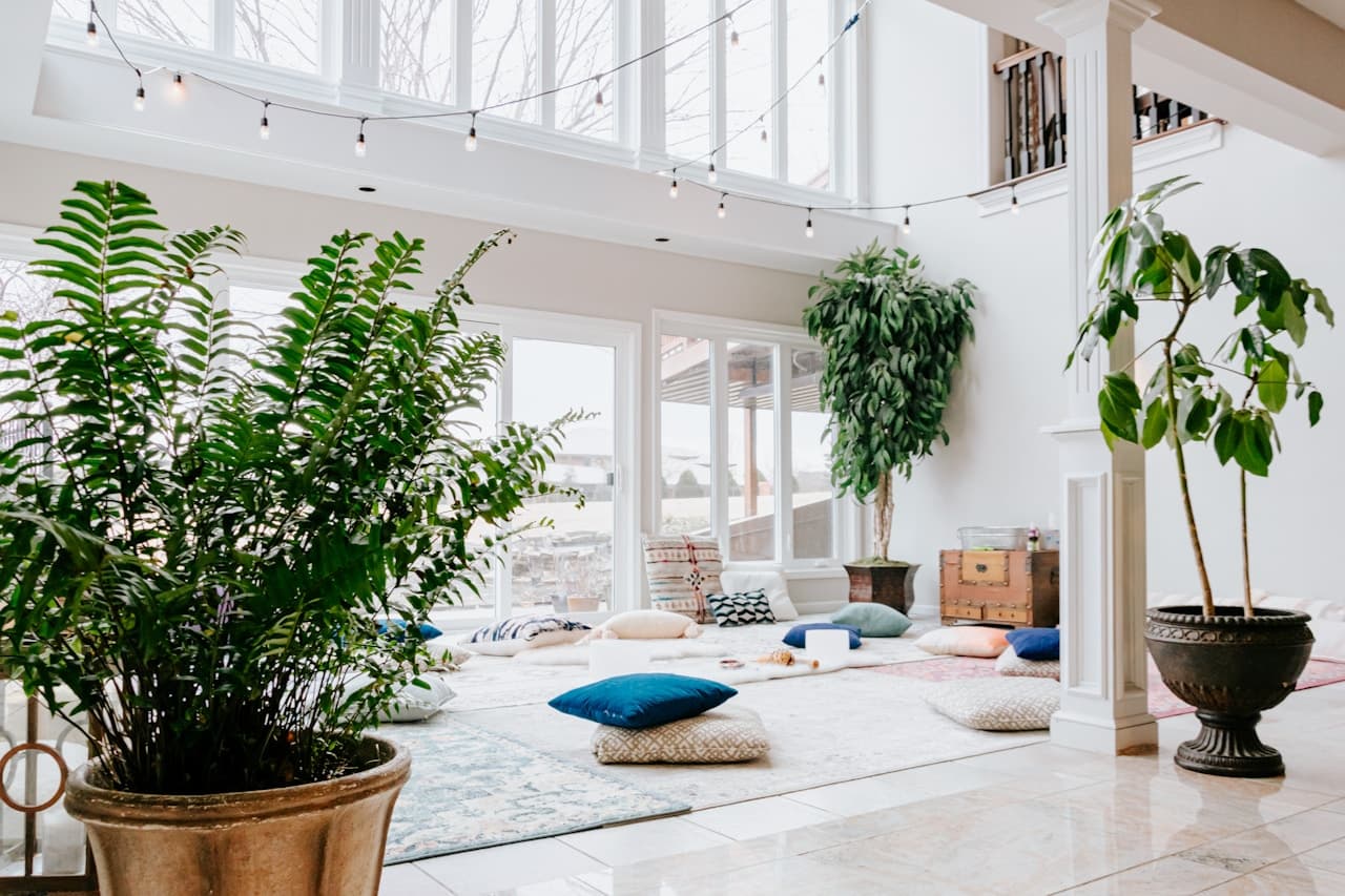 Movement studio with natural light and yoga mats